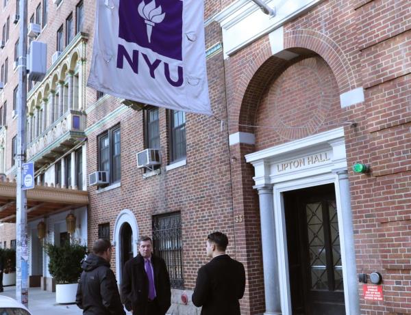 Photo of men outside of NYU dorm Lipton Hall