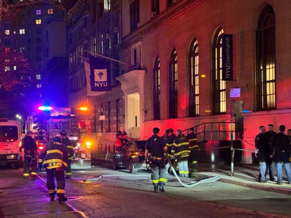 Firefighters outside of NYU building after a student's body was found. 