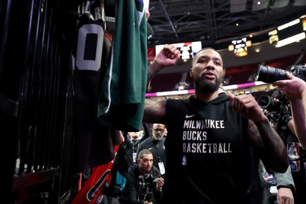 Damian Lillard signs autographs in his return to Portland on Wednesday. 