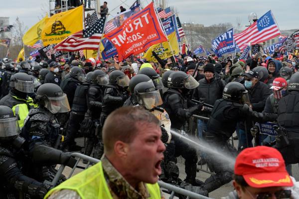 Trump supporters clash with police and security forces as people try to storm the US Capitol in Washington D.C on January 6, 2021.