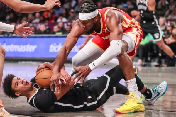 Cameron Johnson (2) and Atlanta Hawks forward Bruno Fernando (24) fight for a loose ball in the fourth quarter at Barclays Center.