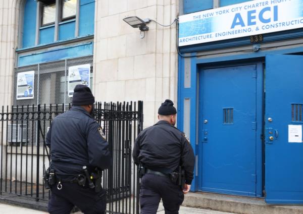 NYPD officers arriving at the Bronx charter school after the stabbing.