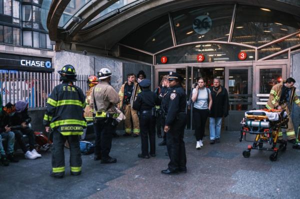 People surrounding subway station after collision