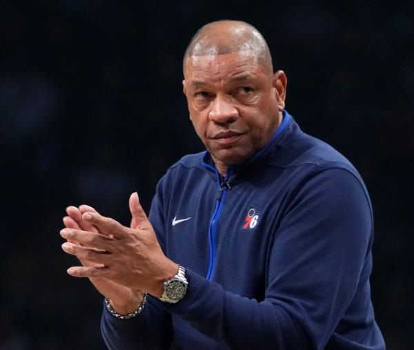 Philadelphia 76ers head coach Doc Rivers claps during the first half of Game 4 in an NBA basketball first-round playoff series against the Brooklyn Nets, April 22, 2023, in New York.