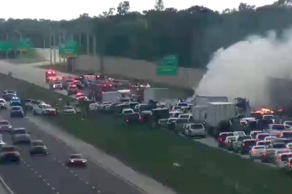 Cars are lined up on I-75 wher<em></em>e the small jet crashed following an emergency landing on Feb. 9, 2024.