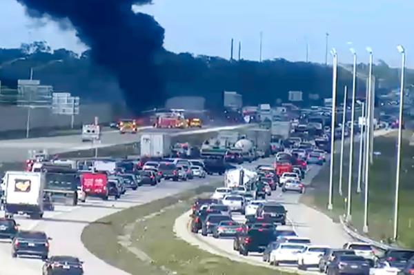 FDOT cameras captured black smoke rising into the air from the remains of a private jet thhat made an emergency landing on I-75 near Naples, Florida on Friday.