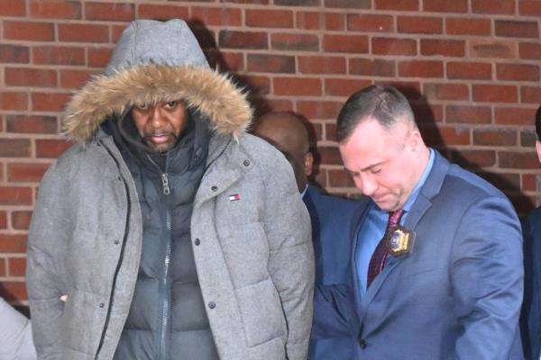 Milton Hamlin, 46, seen in cuffs during his Manhattan perp walk.