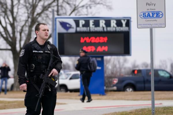 Police officers at the scene of the school shooting in Perry, Iowa.