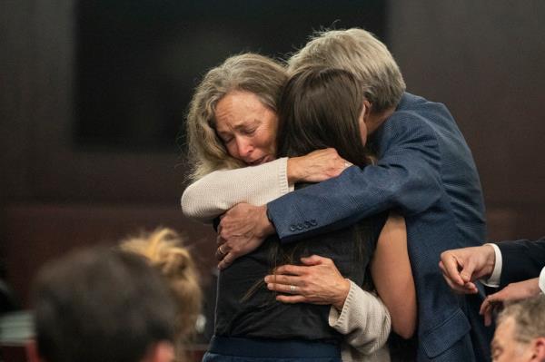 Wilson's parents Karen Wilson and Eric Wilson embrace at Armstrong's sentencing.