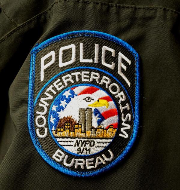 A counterterrorism burau patch shows the World Trade Center and a reference to the Sept. 11 attacks.