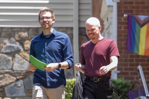 Brinton seen walking with his husband Kevin Rieck outside of their Rockville, Maryland home on June 2, 2023.