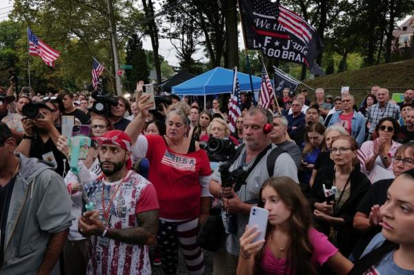 Staten Island residents gather to protest outside of a closed Catholic school-turned-migrant shelter on Staten Island on August 28, 2023 in New York City