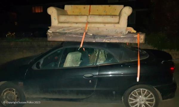 Undated handout photo issued by Sussex Police of a sofa and mattress on the soft roof of a co<em></em>nvertible car which Matthew Dummer was driving. Matthew was co<em></em>nvicted of dangerous driving after he drove away with the furniture on top of his Renault Coupe from his home in Common View, Stedham, West Sussex, in April 2021 despite being advised not to by a police officer. Issue date: Wednesday August 9, 2023. PA Photo. See PA story POLICE Sofa. Photo credit should read: Sussex Police/PA Wire NOTE TO EDITORS: This handout photo may o<em></em>nly be used in for editorial reporting purposes for the co<em></em>ntemporaneous illustration of events, things or the people in the image or facts mentio<em></em>ned in the caption. Reuse of the picture may require further permission from the copyright holder.