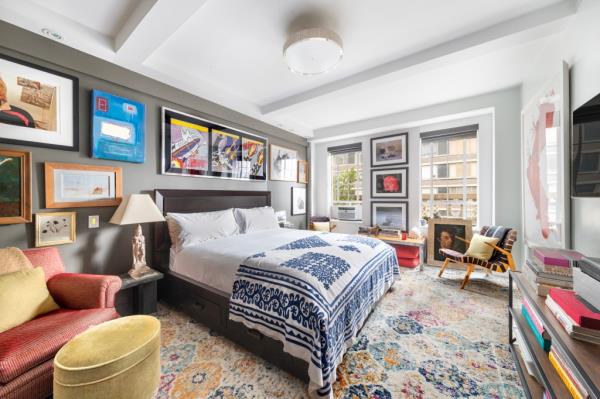 Beamed ceilings extend into the bedroom.