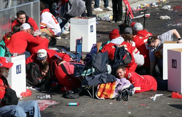 eople flee after shots were fired near the Kansas City Chiefs’ Super Bowl LVIII victory parade on Feb. 14, 2024, in Kansas City.