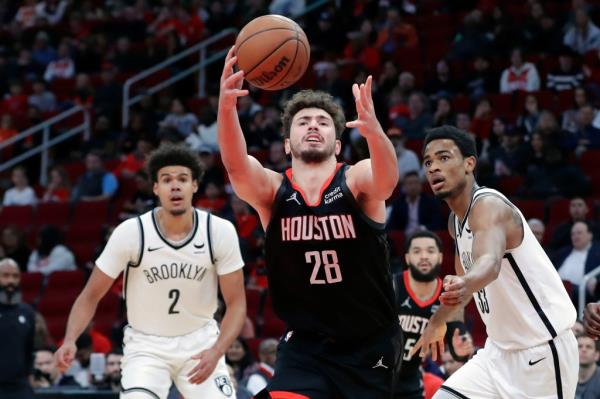 Alperen Sengun, who scored a game-high 30 points for Houston, grabs a rebound during the Nets' 112-101 loss to the Rockets.