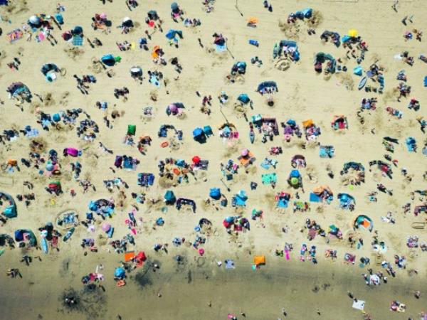 Crowds of people relaxing on a beach