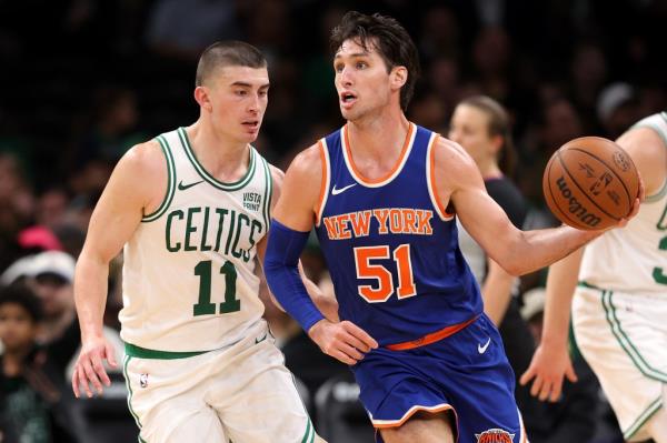  Payton Pritchard #11 of the Boston Celtics defends Ryan Arcidiacono #51 of the New York Knicks