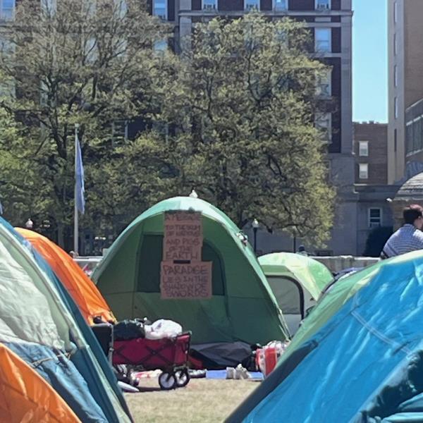 Posters on a tent saying 