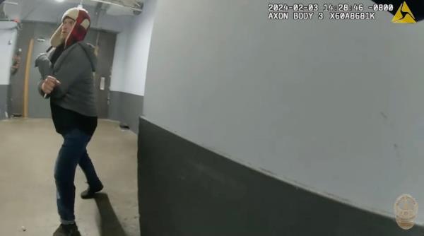 Screenshot from LAPD body camera video shows Jason Maccani, 36, holding in his right hand a white plastic fork