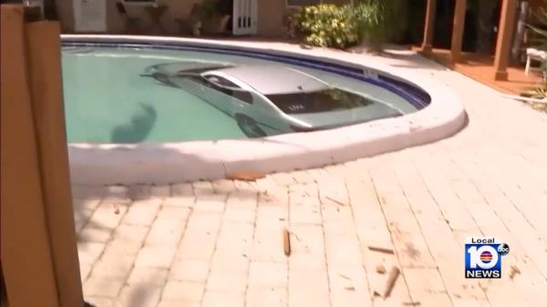 Car submerged in a pool in Florida.