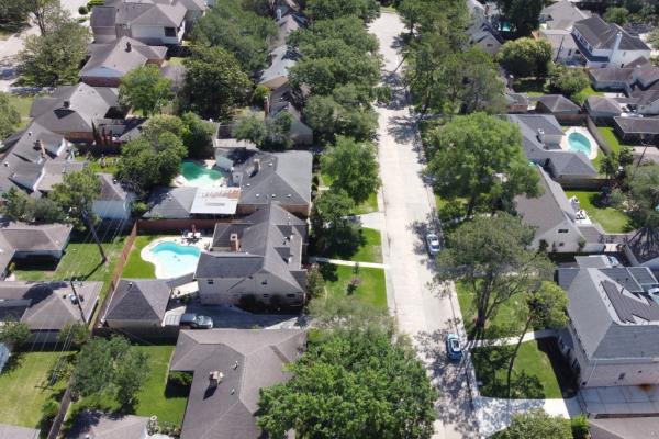 An aerial view of houses in a residential neighborhood of Houston, TX as seen on April 16, 2023. 