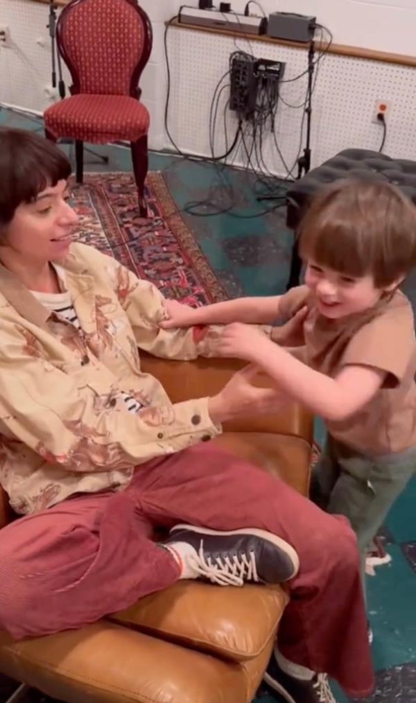 Kate Micucci and her son via TikTok celebrating being cancer-free.