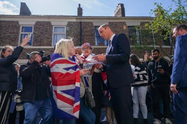 Prince William talking to a crowd. 