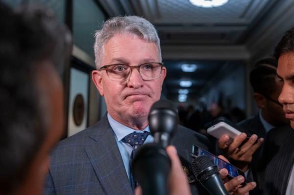 Rep. Brandon Williams, R-N.Y., speaks with reporters as he departs as Republicans meet to decide who to nominate to be the new House speaker in October.