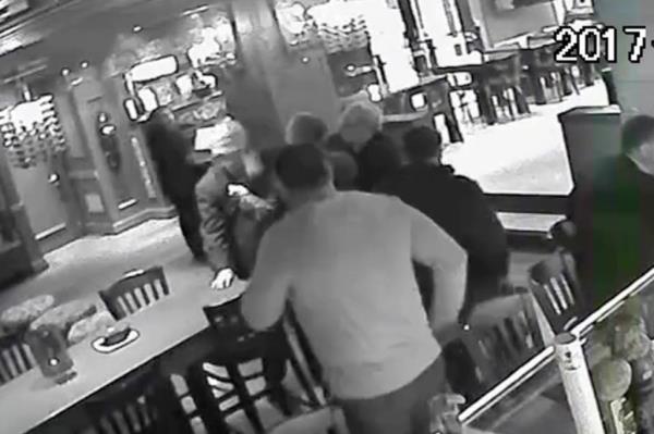 Surveillance video still of Anthony Romanello allegedly punching Shuqeri Selimaj