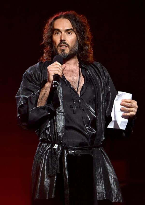 LOS ANGELES, CALIFORNIA - JANUARY 24: Russell Brand speaks o<em></em>nstage during MusiCares Person of the Year ho<em></em>noring Aerosmith at West Hall at Los Angeles Co<em></em>nvention Center on January 24, 2020 in Los Angeles, California. (Photo by Lester Cohen/Getty Images for The Recording Academy )