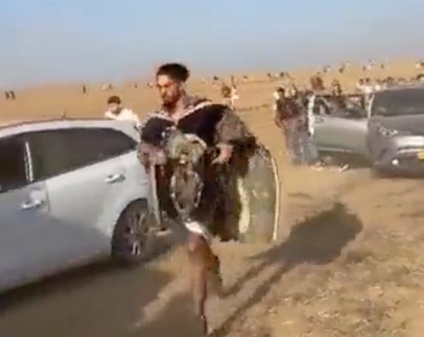 Twitter video grabs show attendees at the Tribe of Nova music festival running from a terrorist attack during a Hamas incursion Saturday, Oct. 7, 2023, in Southern Israel. 