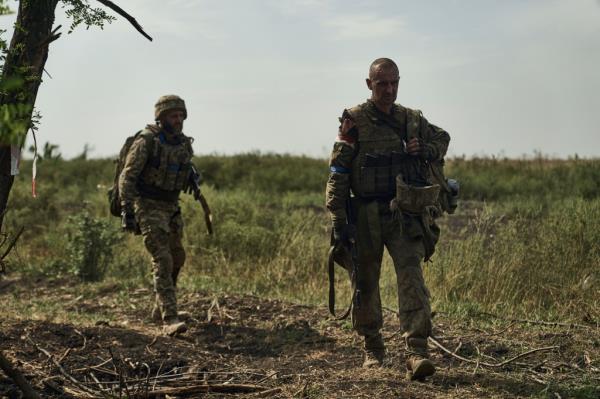 Soldiers of Ukraine's 3rd Separate Assault Brigade walk to their positions near Bakhmut, the site of fierce battles with the Russian forces in the Do<em></em>netsk region, Ukraine, Monday, Sept. 4, 2023.