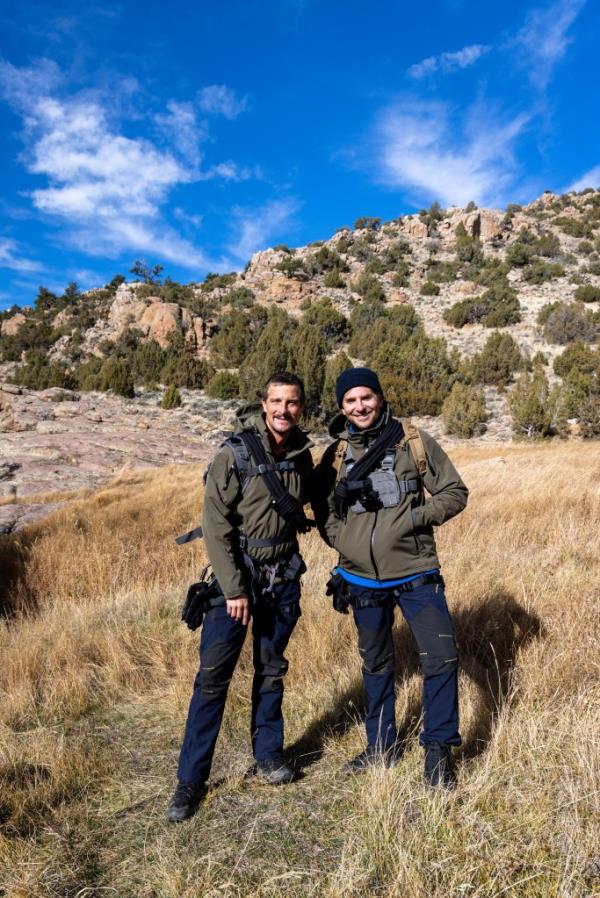 Bear Grylls and Bradley Cooper pose for a portrait during their journey through the Pathfinder Canyon area in Wyoming in an episode of 