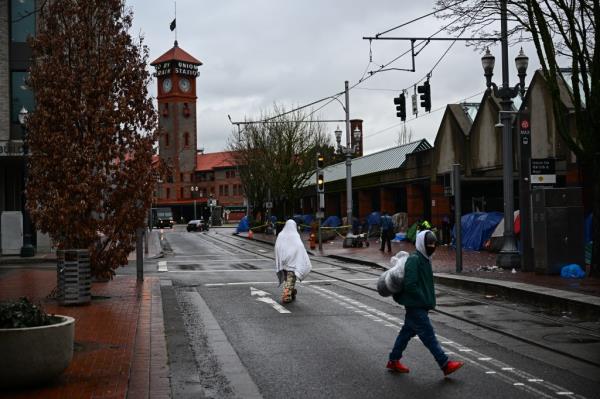 Tents line the sidewalk on SW Clay St in Portland, Ore