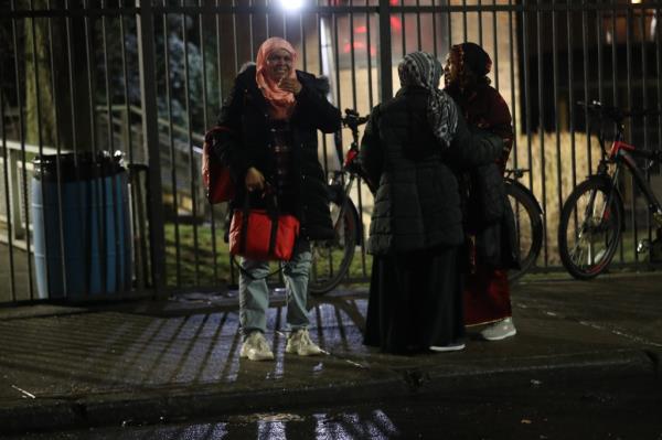 Police and o<em></em>nlookers at the scene of a shooting on McKeever Pl in Brooklyn.