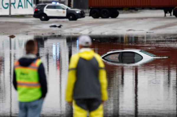 A submerged car during flooding caused by the atmospheric river storm in Long Beach on Feb. 1, 2024.