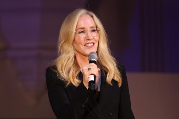 Felicity Huffman in December 2023 speaking at A New Way of Life, women re-entry program gala hosted by her and her husband, William H. Macy.