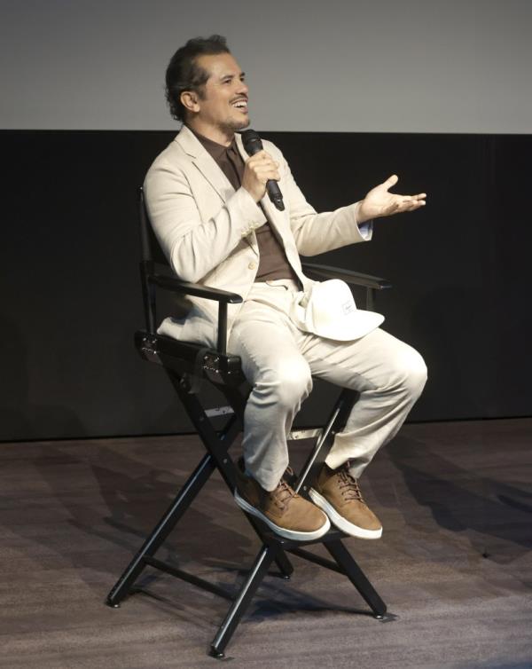 John Leguizamo sitting in a chair with a microphone at The Ankler and Backstage Screening Series of The Green Veil in Los Angeles, California, USA on June 8, 2024.