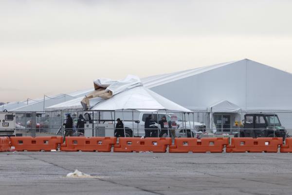 The decision to clear the migrants out of the field came as city officials feared for the safety of the tent city at the field with heavy rains and winds gusting up to 70 mph.