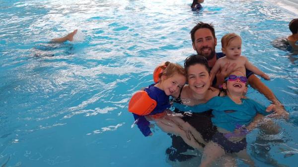 The family enjoys a pool outing