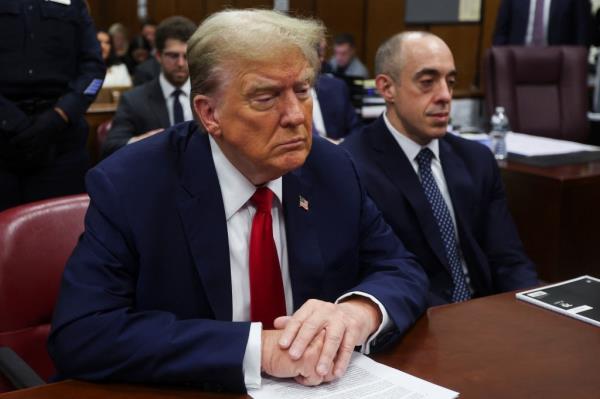 Former U.S. President Do<em></em>nald Trump seated at a table in Manhattan Supreme Court during his hush mo<em></em>ney trial in New York, U.S. May 16 2024.