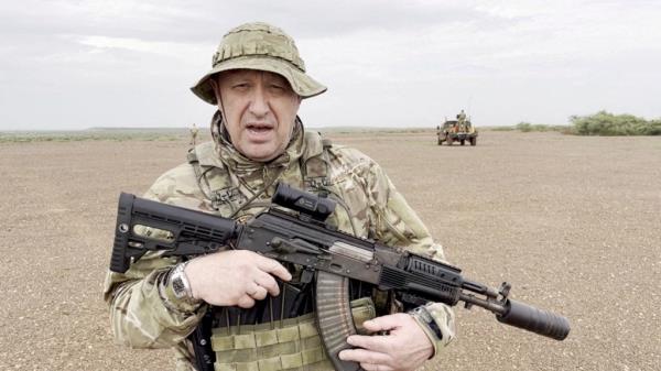 Prigozhin, chief of Russian private mercenary group Wagner, then giving an address in camouflage and with a weapon in his hands in a desert area at an unknown location, in this still image taken from video possibly shot in Africa and published August 21, 2023