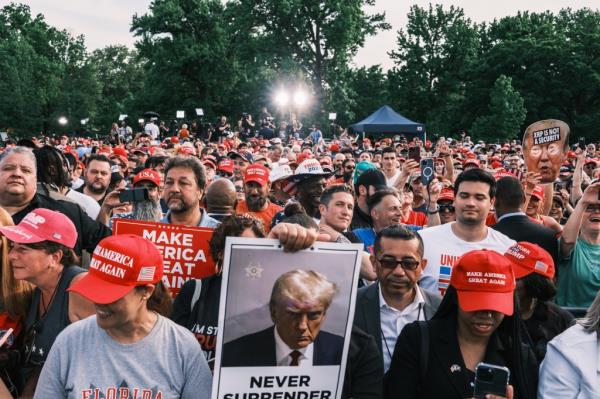 People attend a campaign rally for former US president Do<em></em>nald Trump in Cortona Park in the Bronx