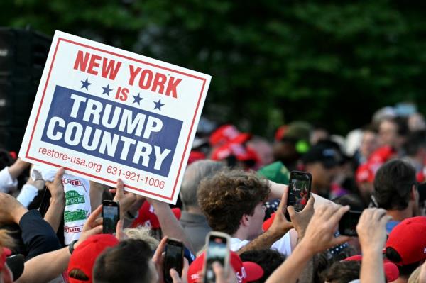 Supporters of former US President and Republican presidential candidate Do<em></em>nald Trump attend a campaign rally in the South Bronx in New York City on May 23, 2024