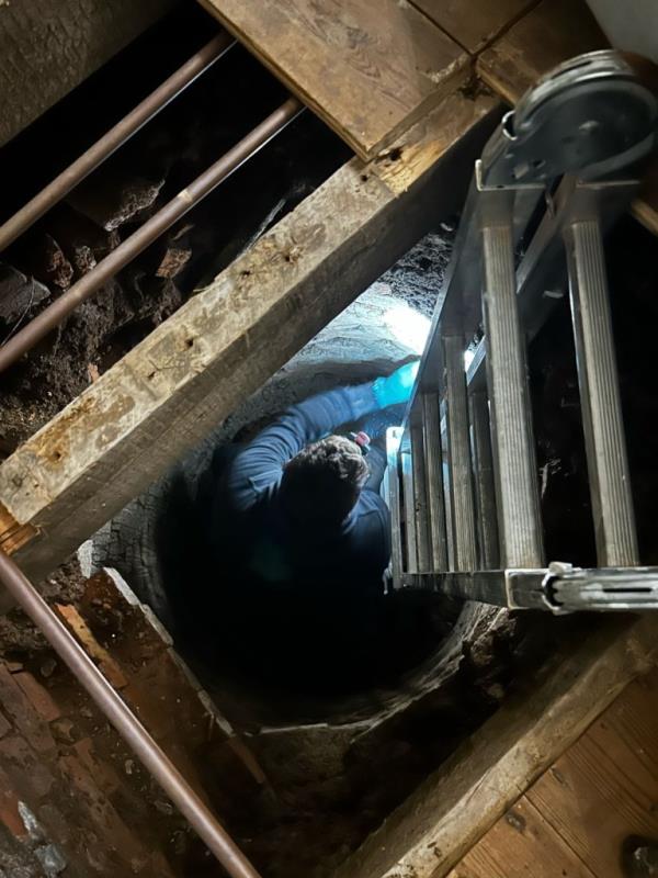 While lifting the floorboards to replace the boiler last month, the couple was shocked to find a ring of bricks with a deep pit in the middle, in front of the bay window.