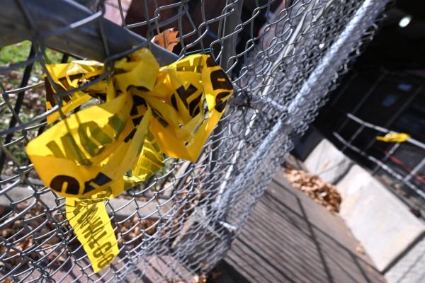 Crime scene tape on fence