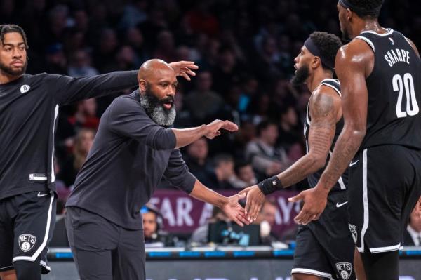 Nets head coach Jacque Vaughn greets the team in the first half against the Milwaukee Bucks at Barclays Center