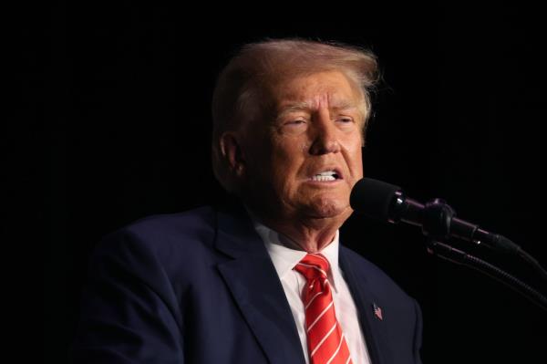 Former President Do<em></em>nald Trump speaks to guests during a campaign stop in Sioux City, Iowa in October.