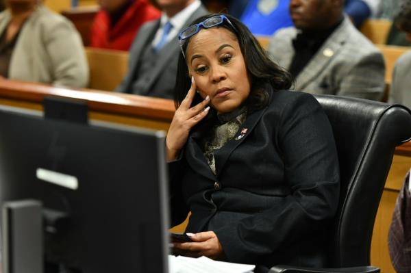 Fulton County District Attorney Fani Willis appears before Judge Scott MacAfee for a hearing in the 2020 Georgia election interference case at the Fulton County Courthouse on Nov. 21.